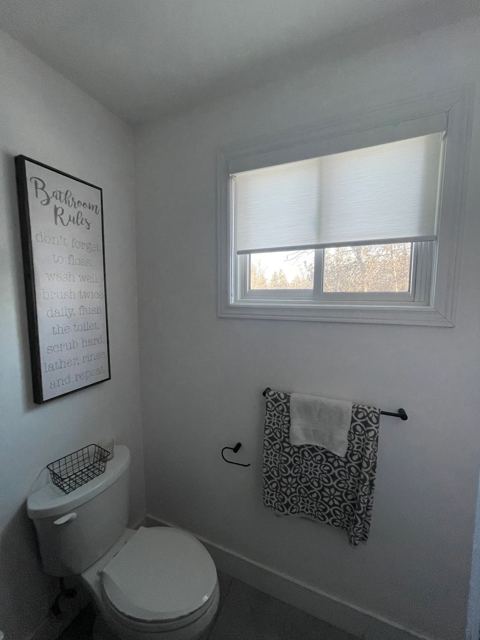 Light-filtering shade in a bathroom