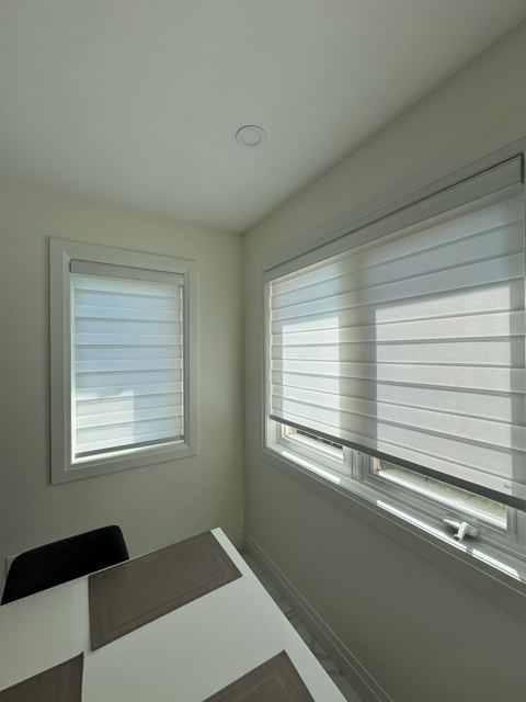 Layered shades in a breakfast nook