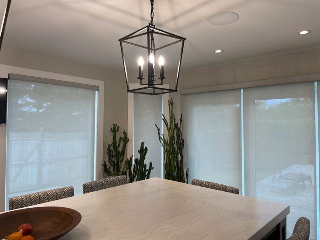 Dining room with patio door shades