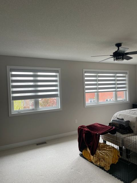 Layered shades on bedroom windows